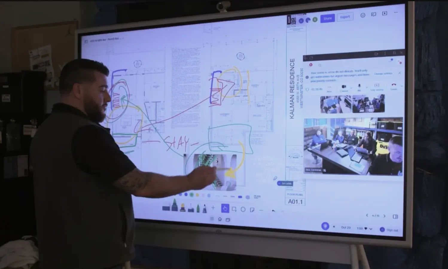 Kurtis Reeme annotating a construction blueprint on the Vibe Board while collaborating remotely with the project team via video call