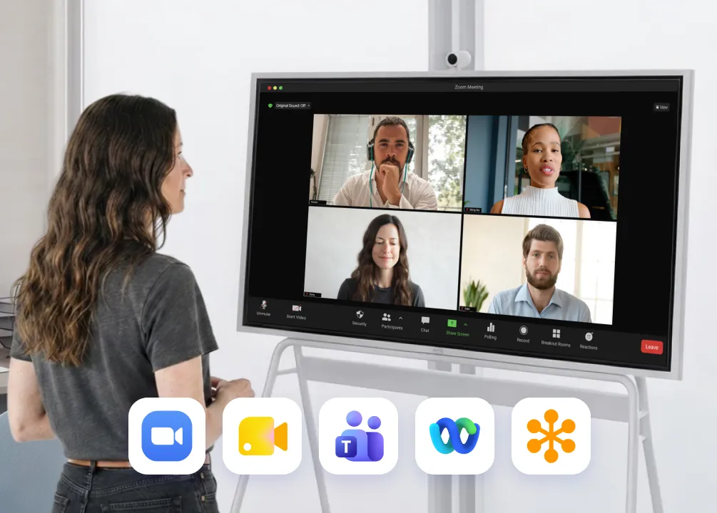 Woman on a Zoom call on Vibe Board at home, with Google Meet, Teams, Webex and GoTo app icons below